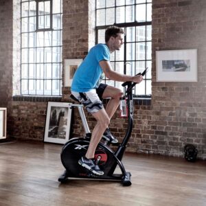 Reebok Fitness Upright Exercise Bike, Bluetooth Stationary Cycling Bike with 24 Resistance Levels, 12 Training Programs, Indoor Bike with Gel Pad Saddle
